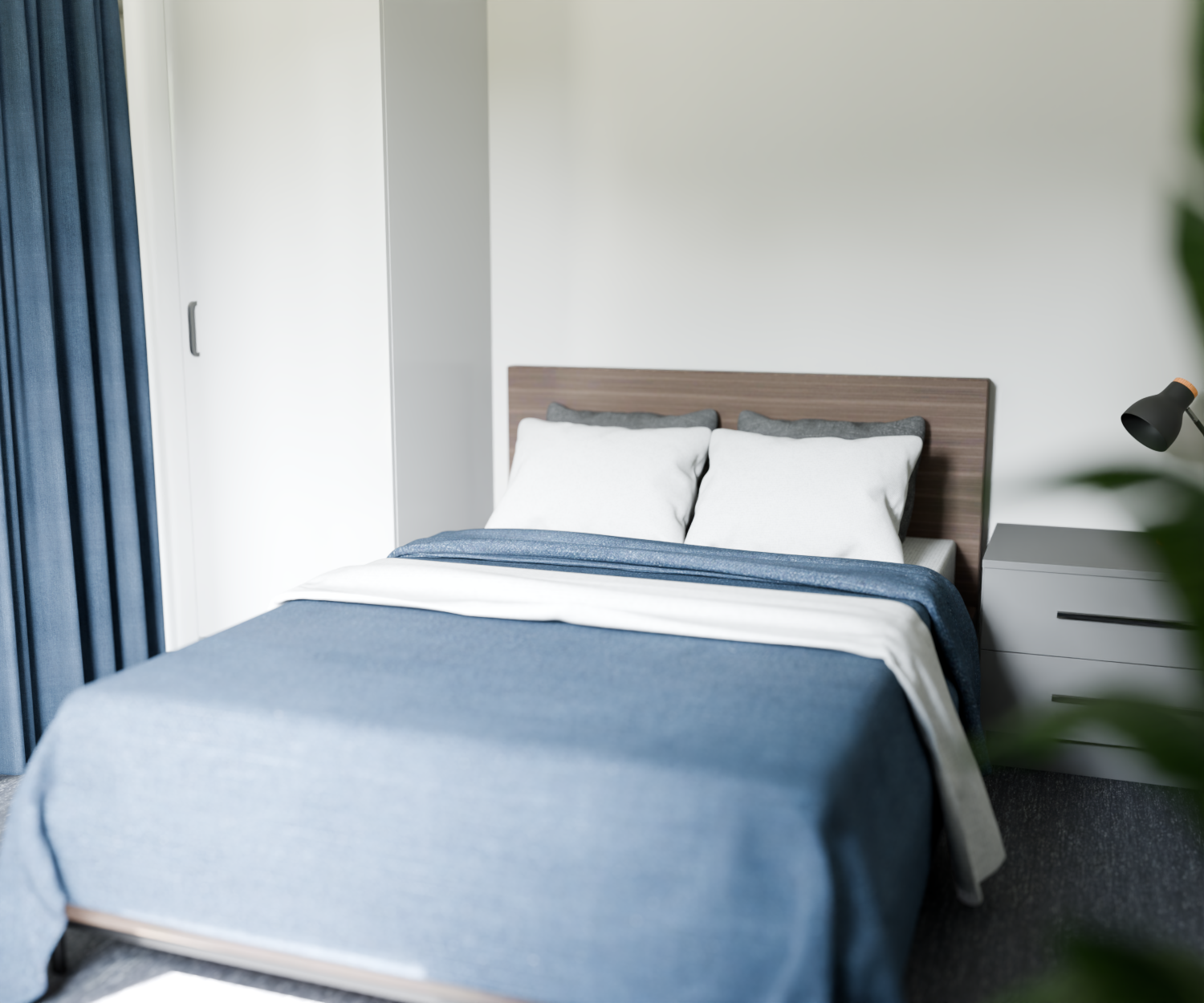 Sovrum i LSS Tureberg med blå sängkläder och ljusa väggar.