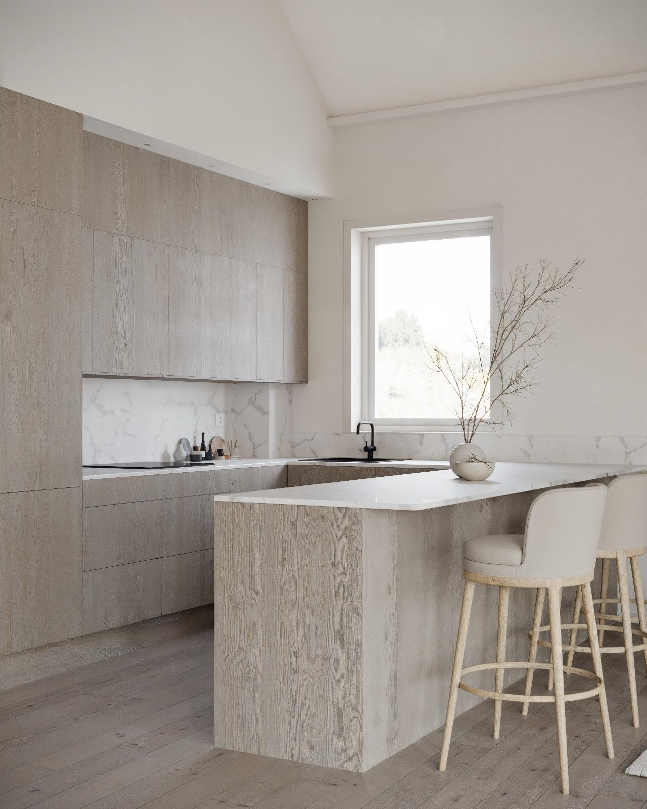 3D-visualisering av ett modernt kök med köksö och skåpsluckor i ljust trä. Bänkskiva och stänkskydd är i vit marmor.